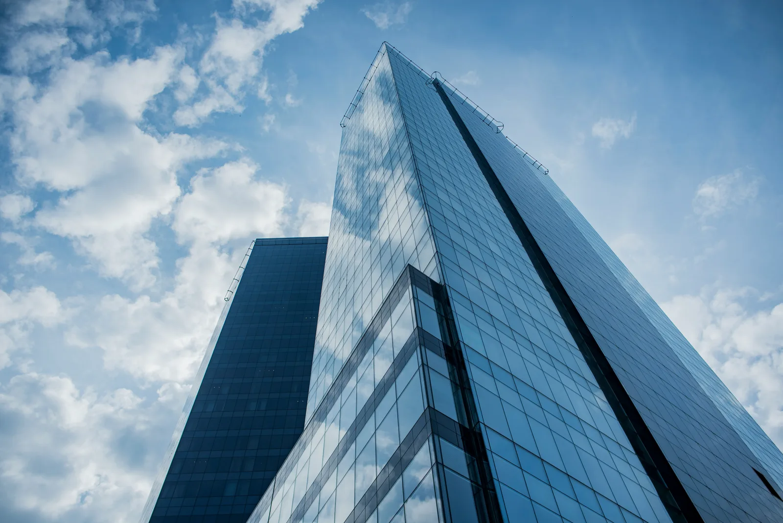 Modern glass building viewed from below